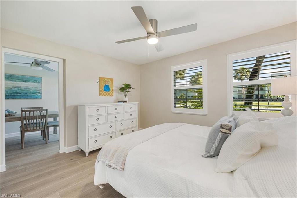 626 12th Avenue South, Unit 626 Naples, FL 34102 - Photo 31 of 50 a bedroom with a large bed and a window