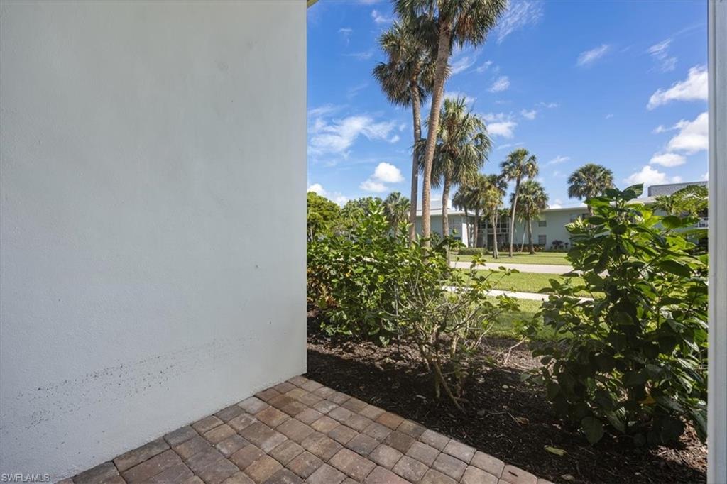 626 12th Avenue South, Unit 626 Naples, FL 34102 - Photo 36 of 50 a view of a garden