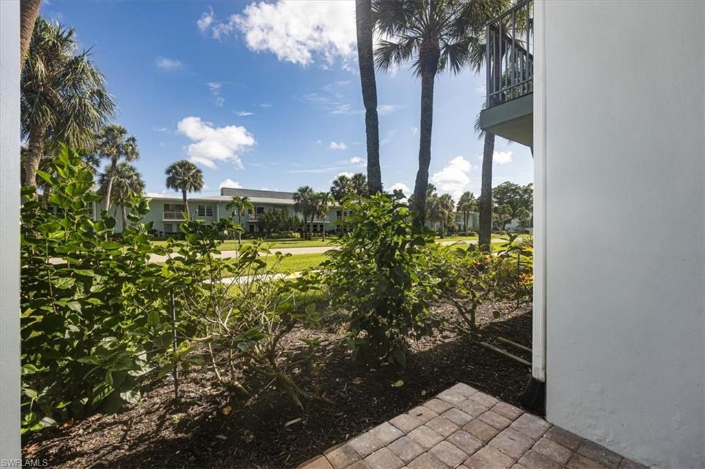 626 12th Avenue South, Unit 626 Naples, FL 34102 - Photo 37 of 50 a view of outdoor space and garden