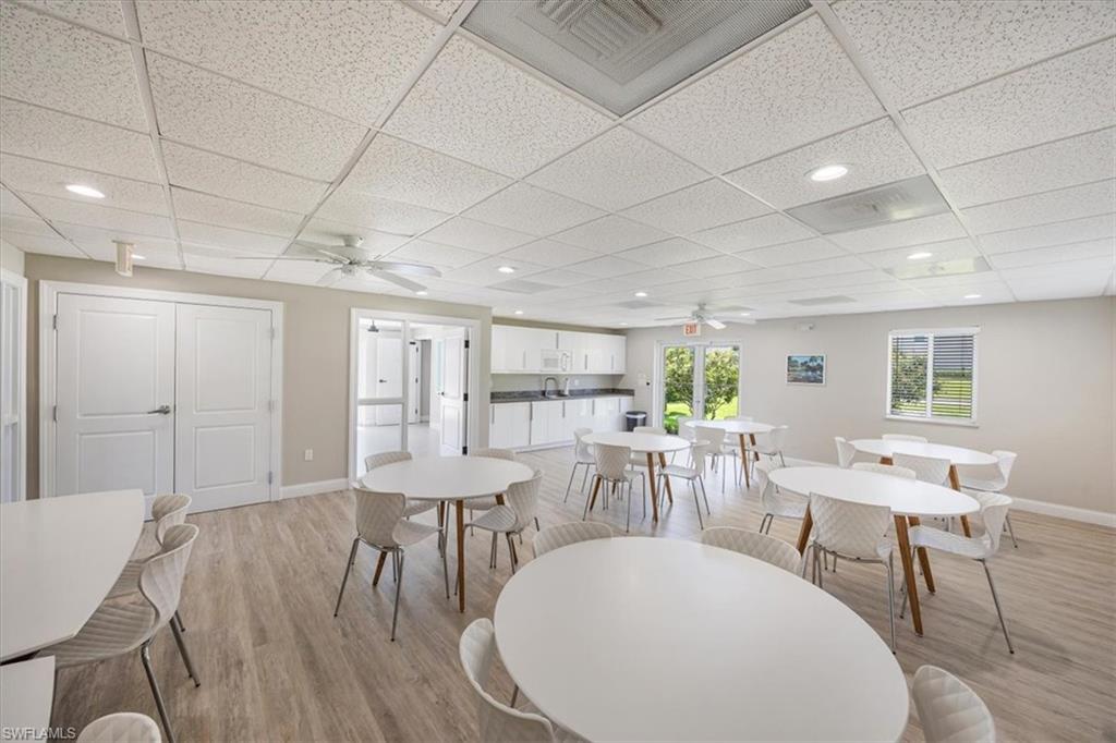 626 12th Avenue South, Unit 626 Naples, FL 34102 - Photo 42 of 50 a view of a dining room with furniture window and wooden floor