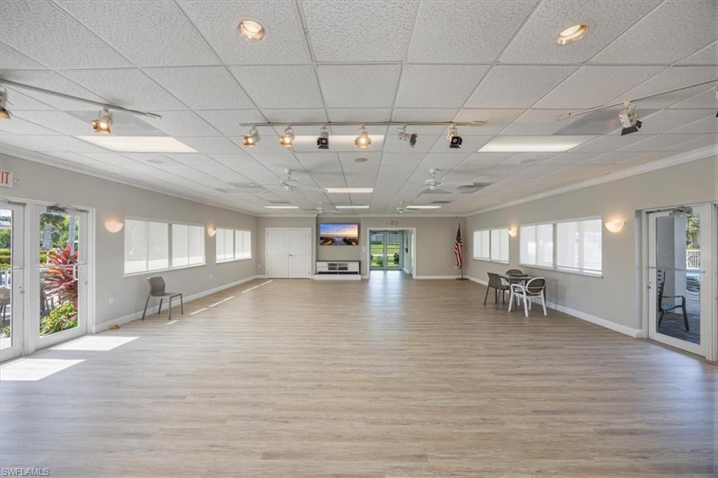 626 12th Avenue South, Unit 626 Naples, FL 34102 - Photo 45 of 50 a view of a livingroom with furniture a ceiling fan and window