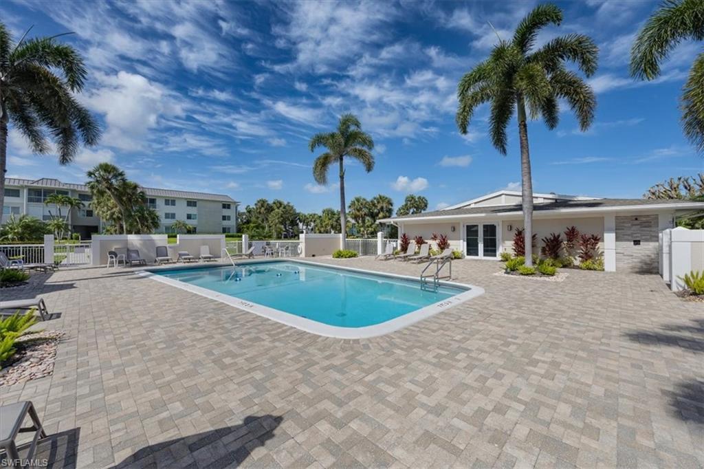 626 12th Avenue South, Unit 626 Naples, FL 34102 - Photo 46 of 50 a house with palm tree in front of it