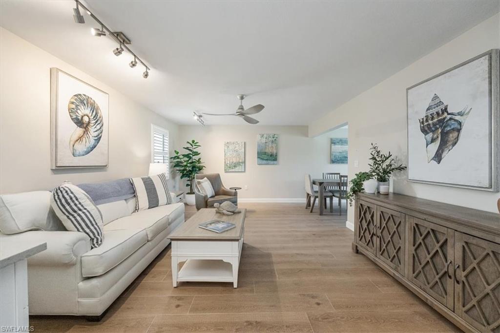626 12th Avenue South, Unit 626 Naples, FL 34102 - Photo 5 of 50 a living room with furniture