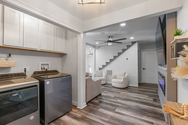 a kitchen with stainless steel appliances granite countertop a stove and a refrigerator