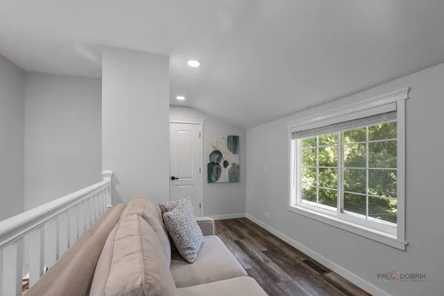 a bed room with furniture and a window