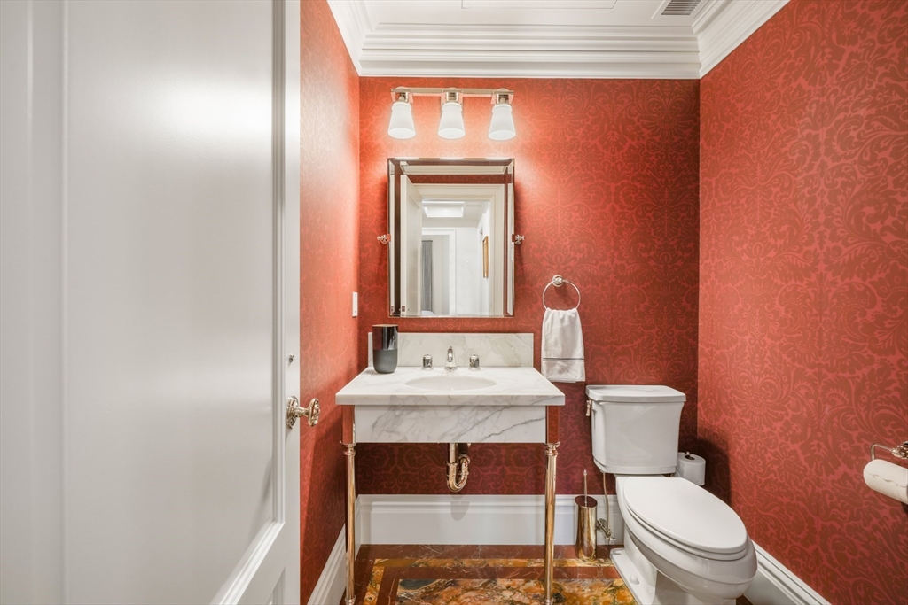 314 Commonwealth Avenue, Unit 2 Boston, MA 02115 - Photo 20 of 31 a bathroom with a toilet a sink and mirror