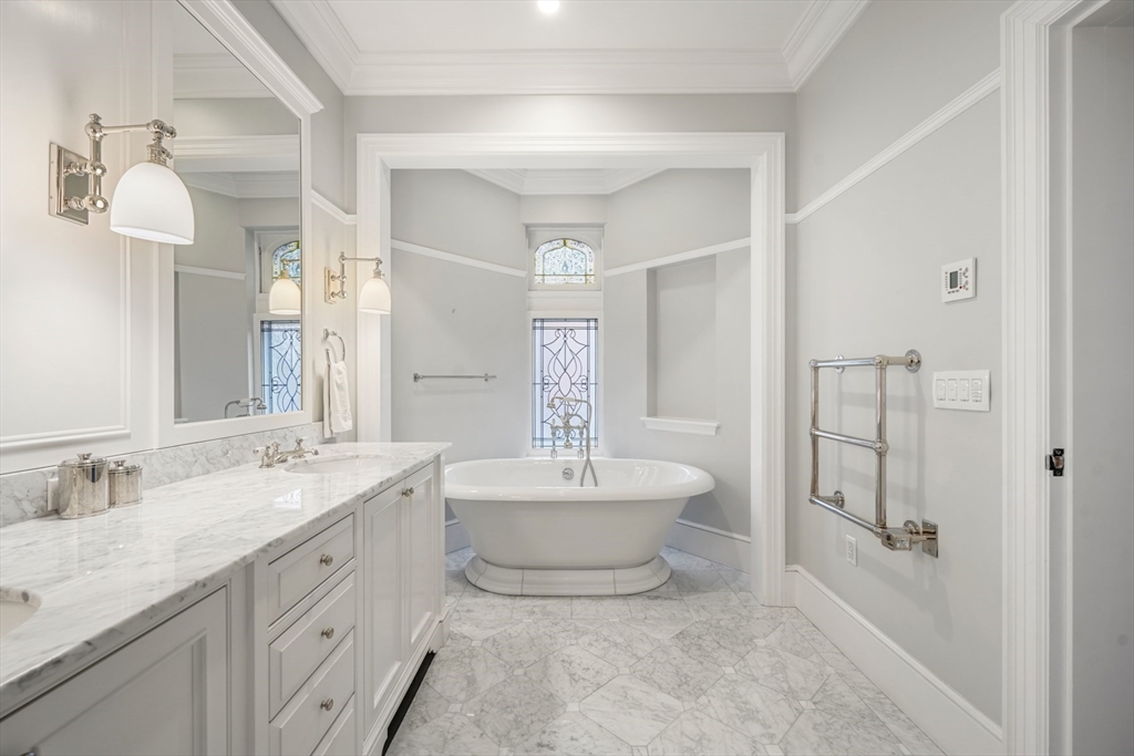 314 Commonwealth Avenue, Unit 2 Boston, MA 02115 - Photo 25 of 31 a spacious bathroom with a double vanity sink mirror and bathtub