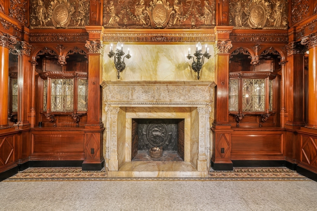 314 Commonwealth Avenue, Unit 2 Boston, MA 02115 - Photo 29 of 31 a living room with a fireplace and a fireplace