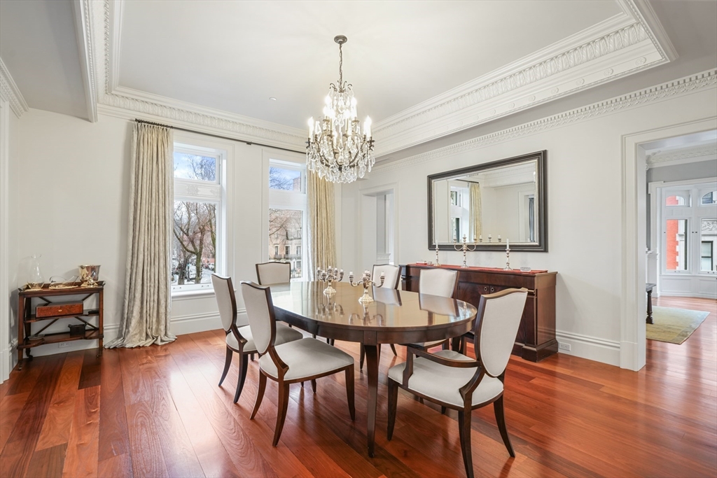 314 Commonwealth Avenue, Unit 2 Boston, MA 02115 - Photo 7 of 31 a view of a dining room with furniture wooden floor and chandelier