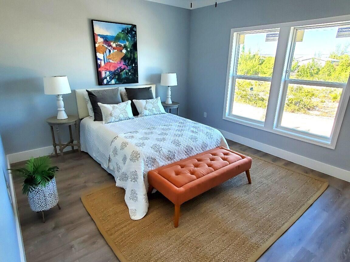 27453 Antigua Road Summerland Key, FL 33042 - Photo 13 of 20 a bed sitting in a bedroom next to a window