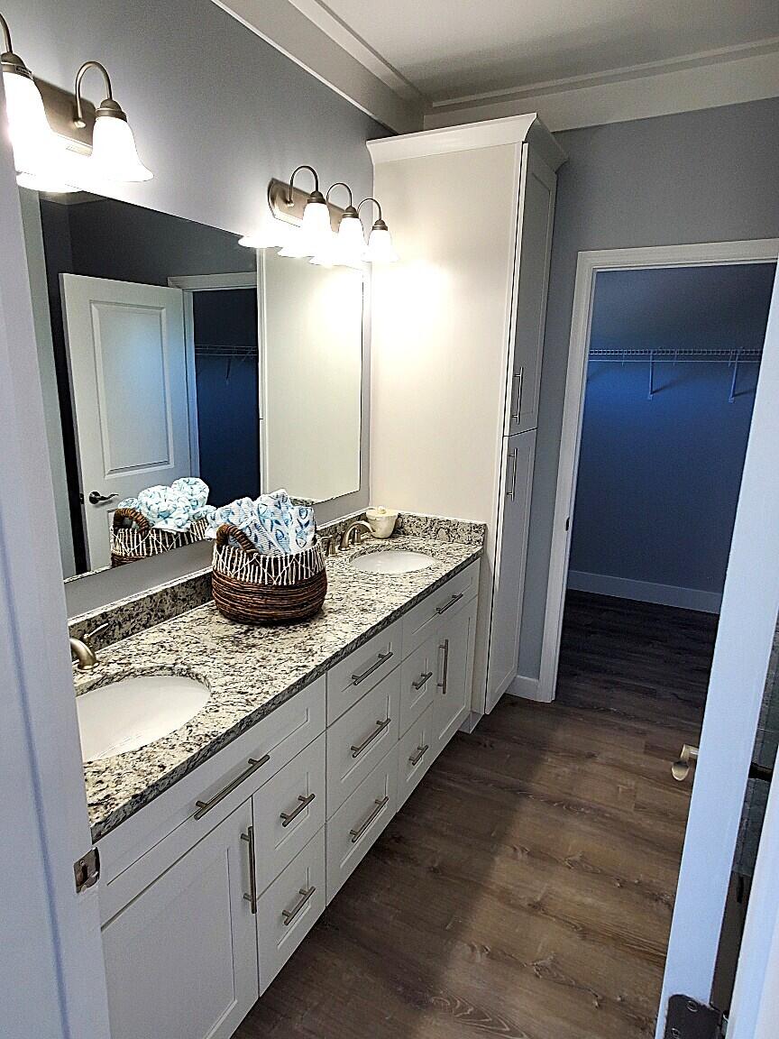 27453 Antigua Road Summerland Key, FL 33042 - Photo 14 of 20 a bathroom with a granite countertop sink and a mirror