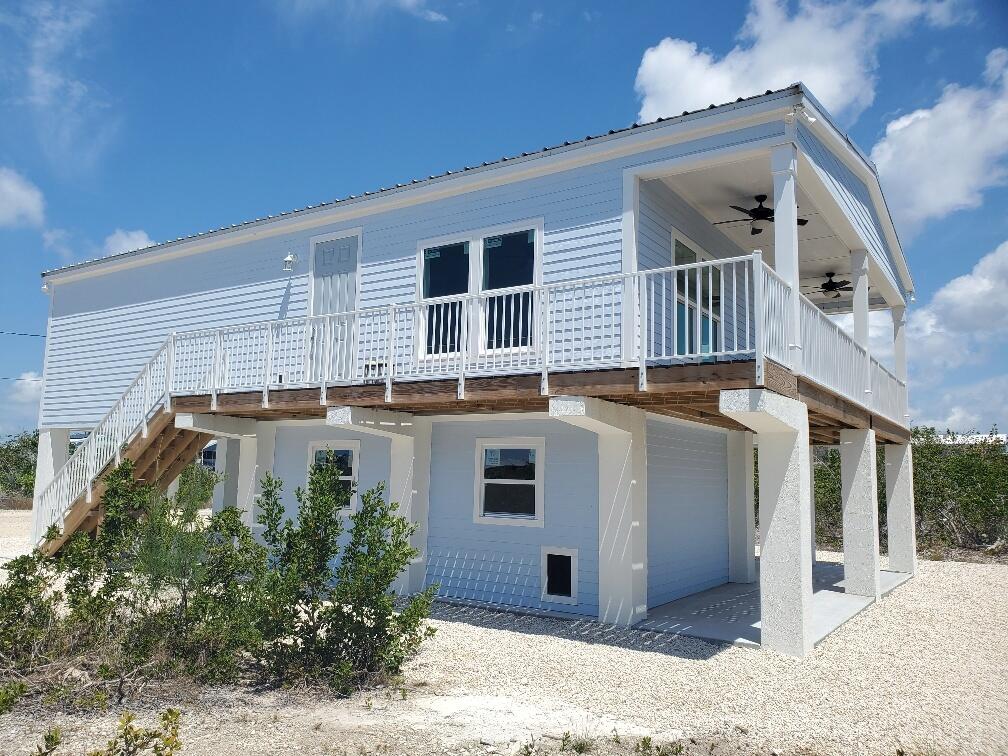 27453 Antigua Road Summerland Key, FL 33042 - Photo 4 of 20 a view of a house with a yard
