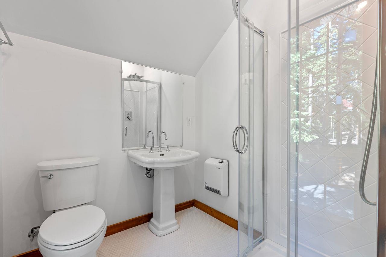 3880 Forest Road Carnelian Bay, CA 96140 - Photo 27 of 28 a bathroom with a toilet sink and shower