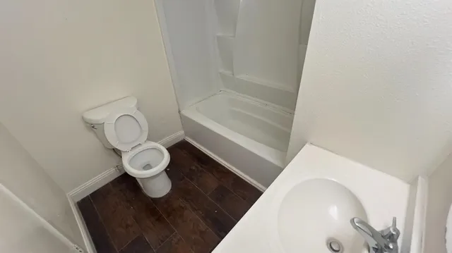 a bathroom with a toilet and a sink