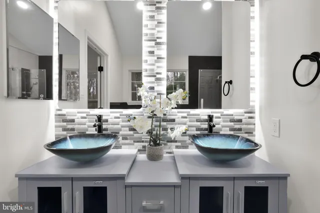 a dining room with table and flowerpot