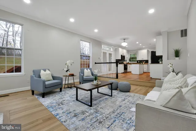 a living room with furniture and a table