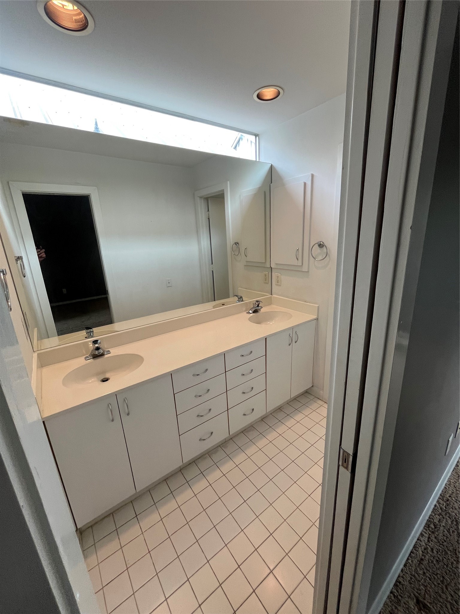 1315 Buckner Street Houston, TX 77019 - Photo 18 of 23 a bathroom with a double vanity sink and mirror
