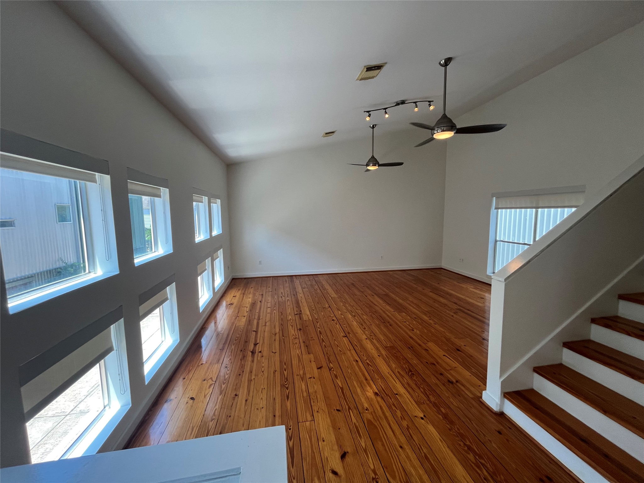 1315 Buckner Street Houston, TX 77019 - Photo 3 of 23 a view of a livingroom with wooden floor and staircase