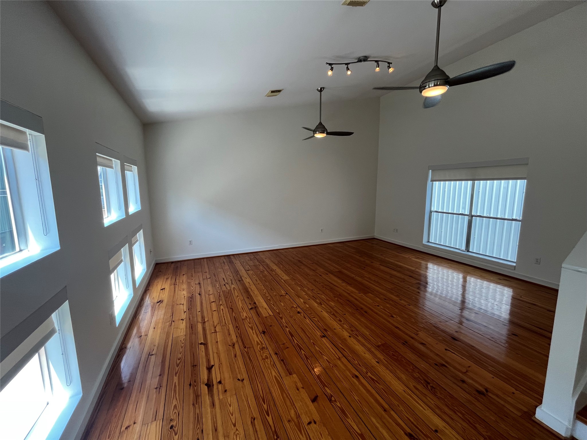 1315 Buckner Street Houston, TX 77019 - Photo 4 of 23 a view of empty room with wooden floor and fan