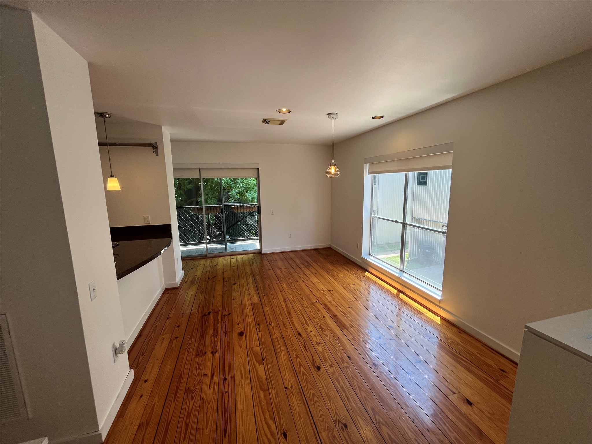 1315 Buckner Street Houston, TX 77019 - Photo 7 of 23 wooden floor in an empty room with a window