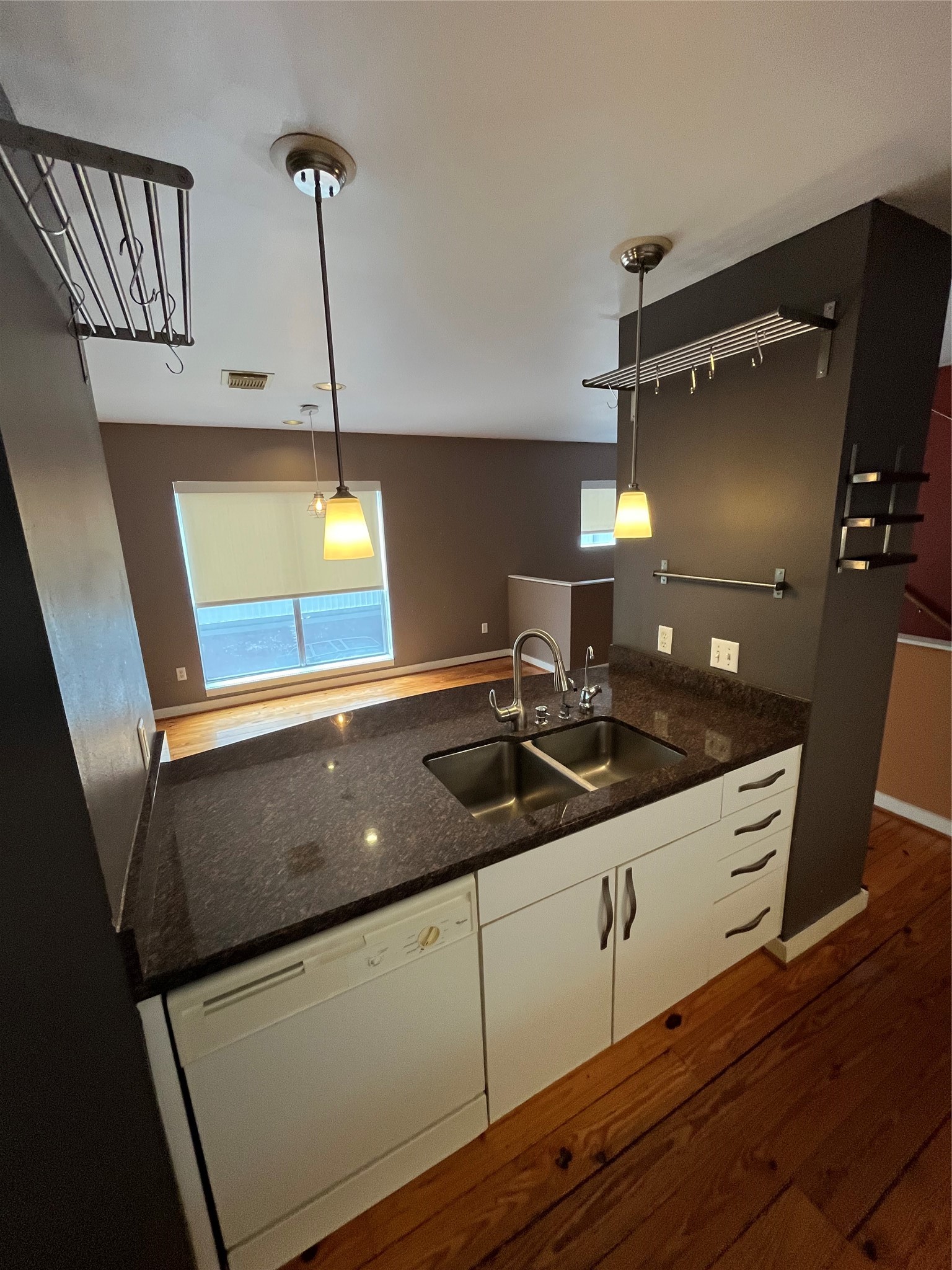 1315 Buckner Street Houston, TX 77019 - Photo 9 of 23 a kitchen with a sink and wooden floor