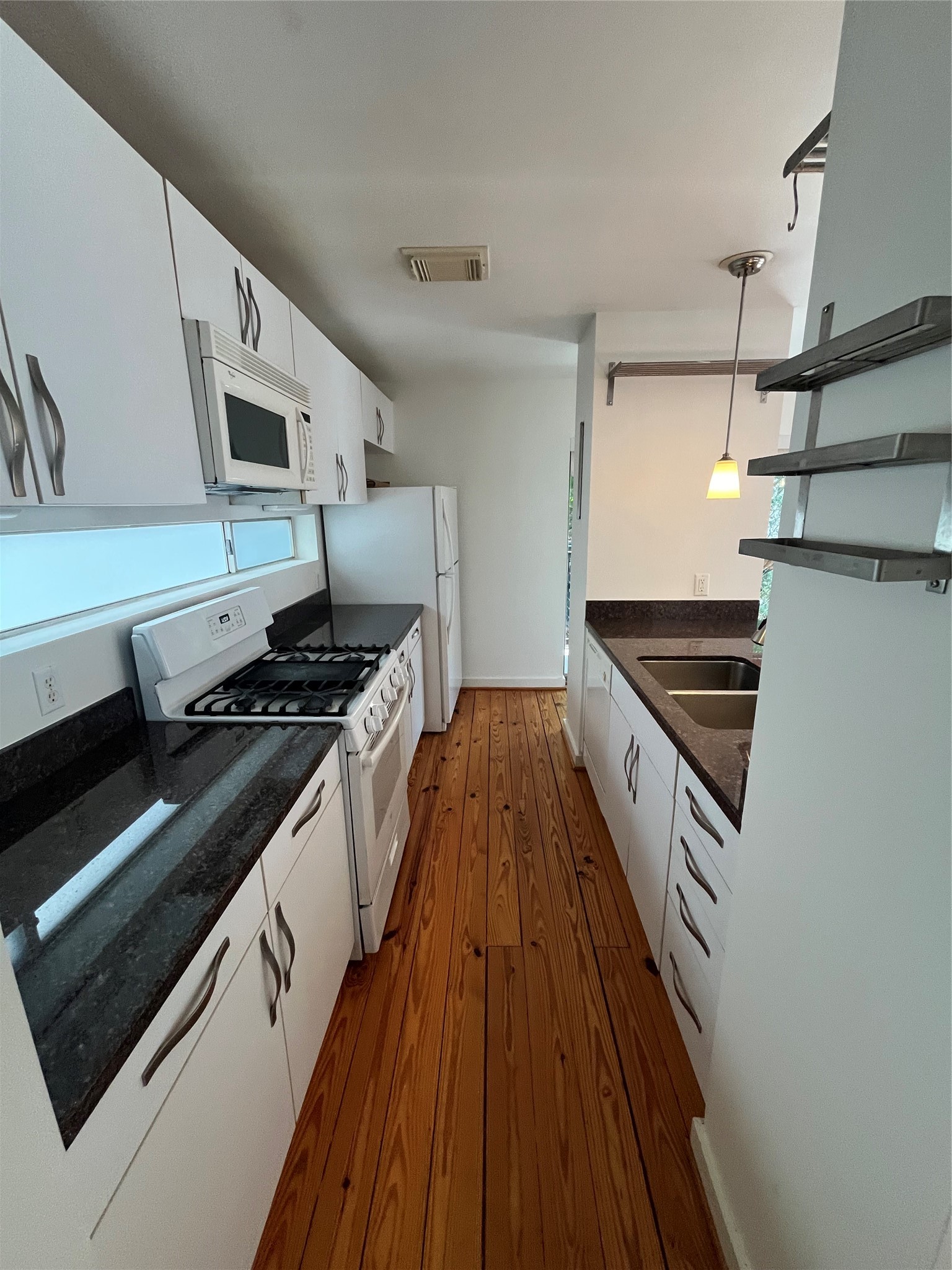 1315 Buckner Street Houston, TX 77019 - Photo 10 of 23 a kitchen with stove and cabinets
