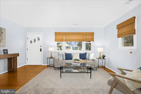 a view of a livingroom with furniture and a window