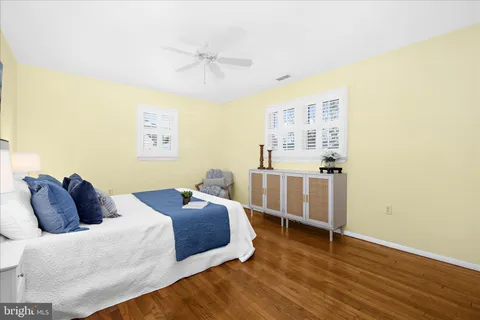 a bedroom with two beds and a table