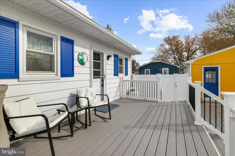a view of a patio with a table and chairs