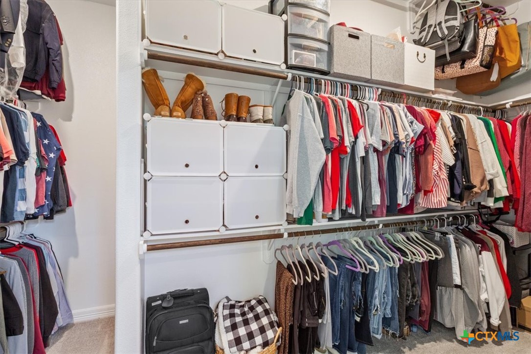 102 Rancho Del Lago Lane Belton, TX 76513 - Photo 23 of 40 a view of walk in closet with clothes