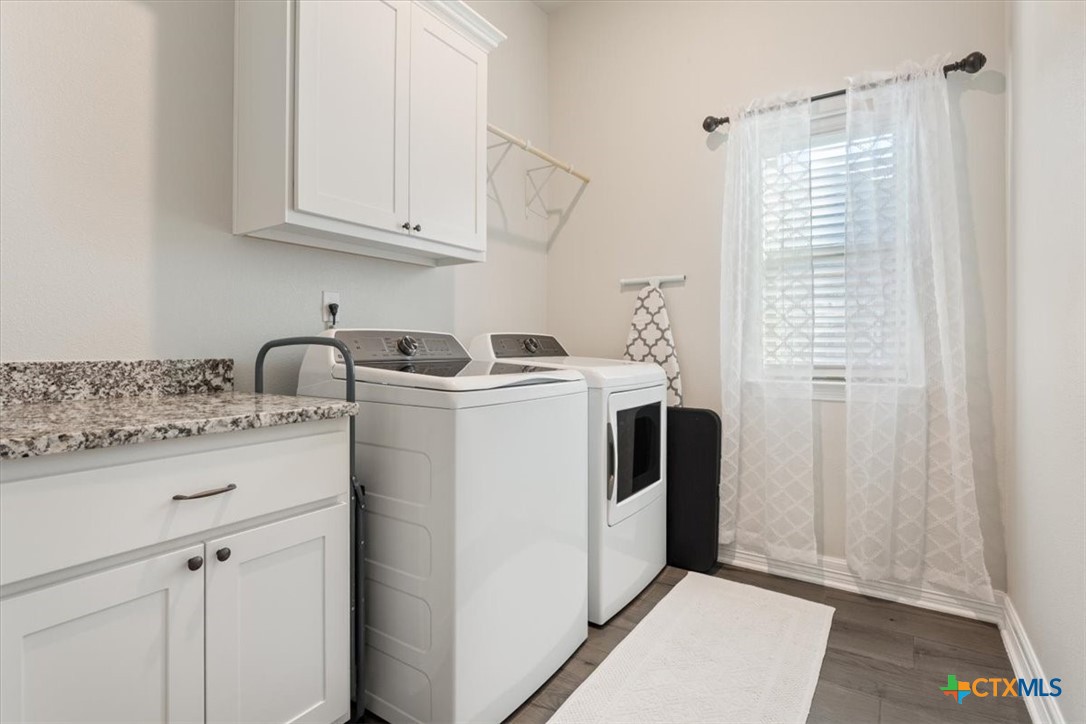 102 Rancho Del Lago Lane Belton, TX 76513 - Photo 24 of 40 a utility room with dryer and washer