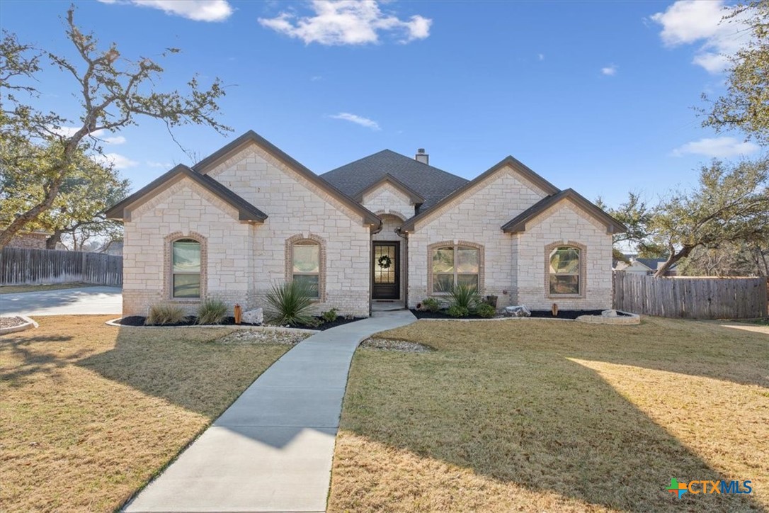 102 Rancho Del Lago Lane Belton, TX 76513 - Photo 4 of 40 a view of a house with a yard and large tree