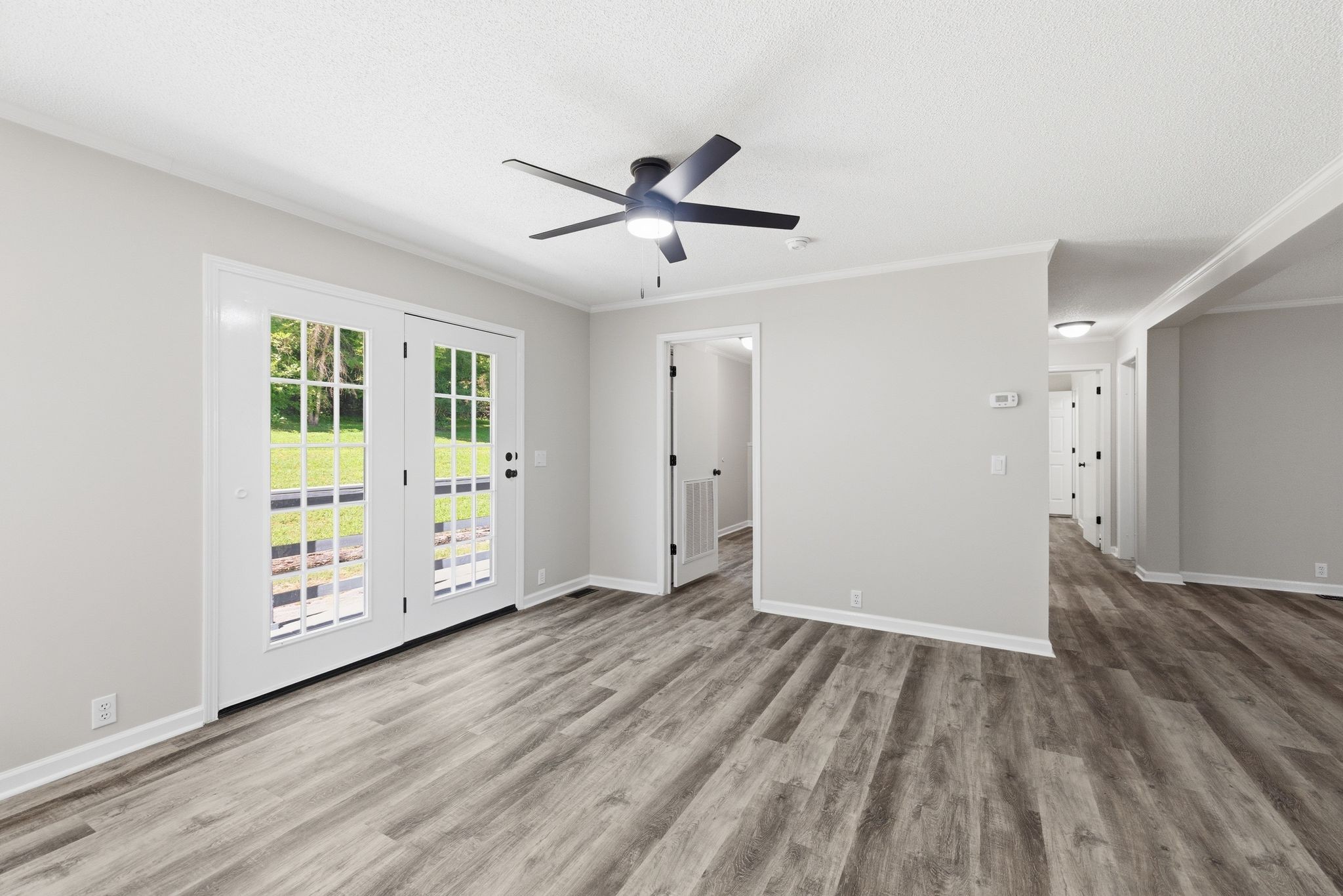 1021 B Jordan Road Lascassas, TN 37085 - Photo 22 of 58 a view of an empty room with wooden floor and a window