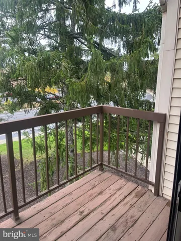 a view of outdoor space with wooden floor