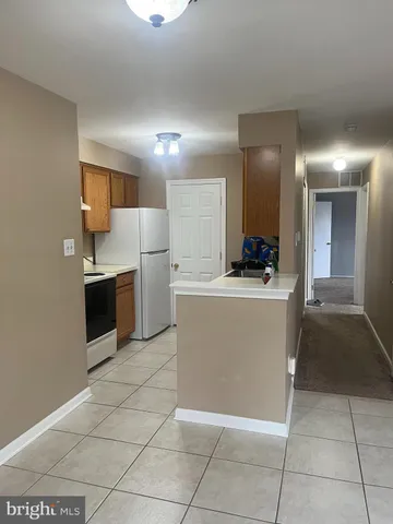 a view of a kitchen with a sink