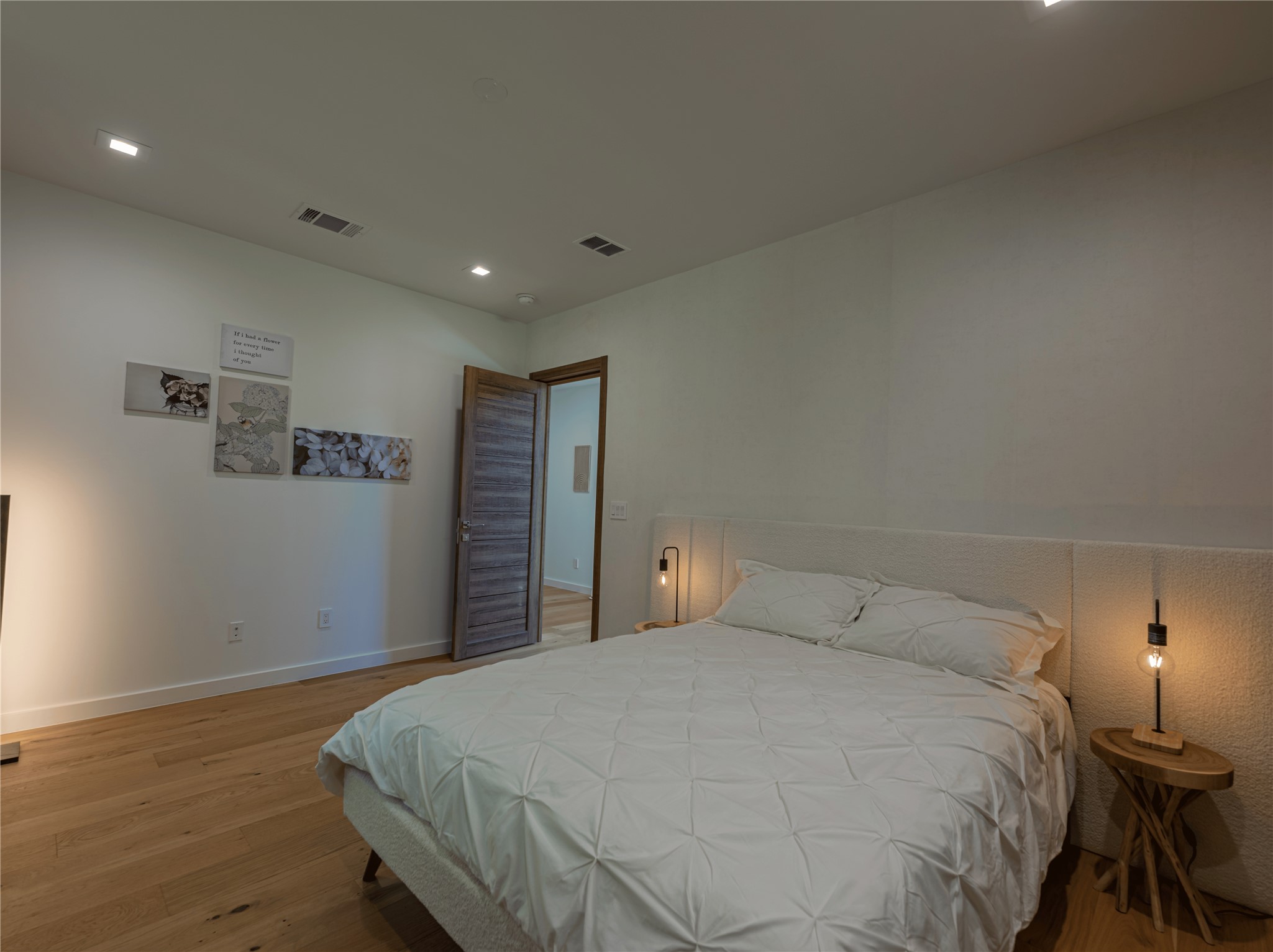2806 Geronimo Trail Austin, TX 78734 - Photo 20 of 36 a bedroom with a bed and a night stand