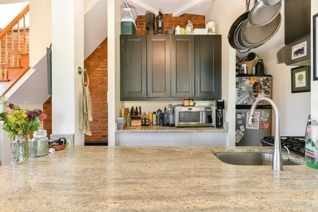 a bedroom with bed and wooden floor