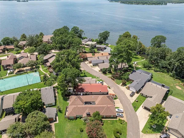 an aerial view of a house with yard