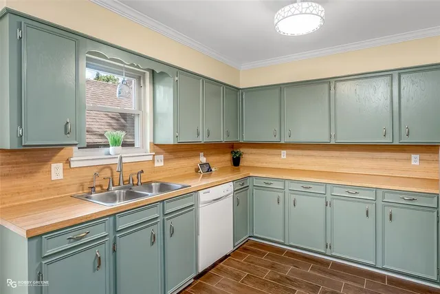 a kitchen with sink and cabinets