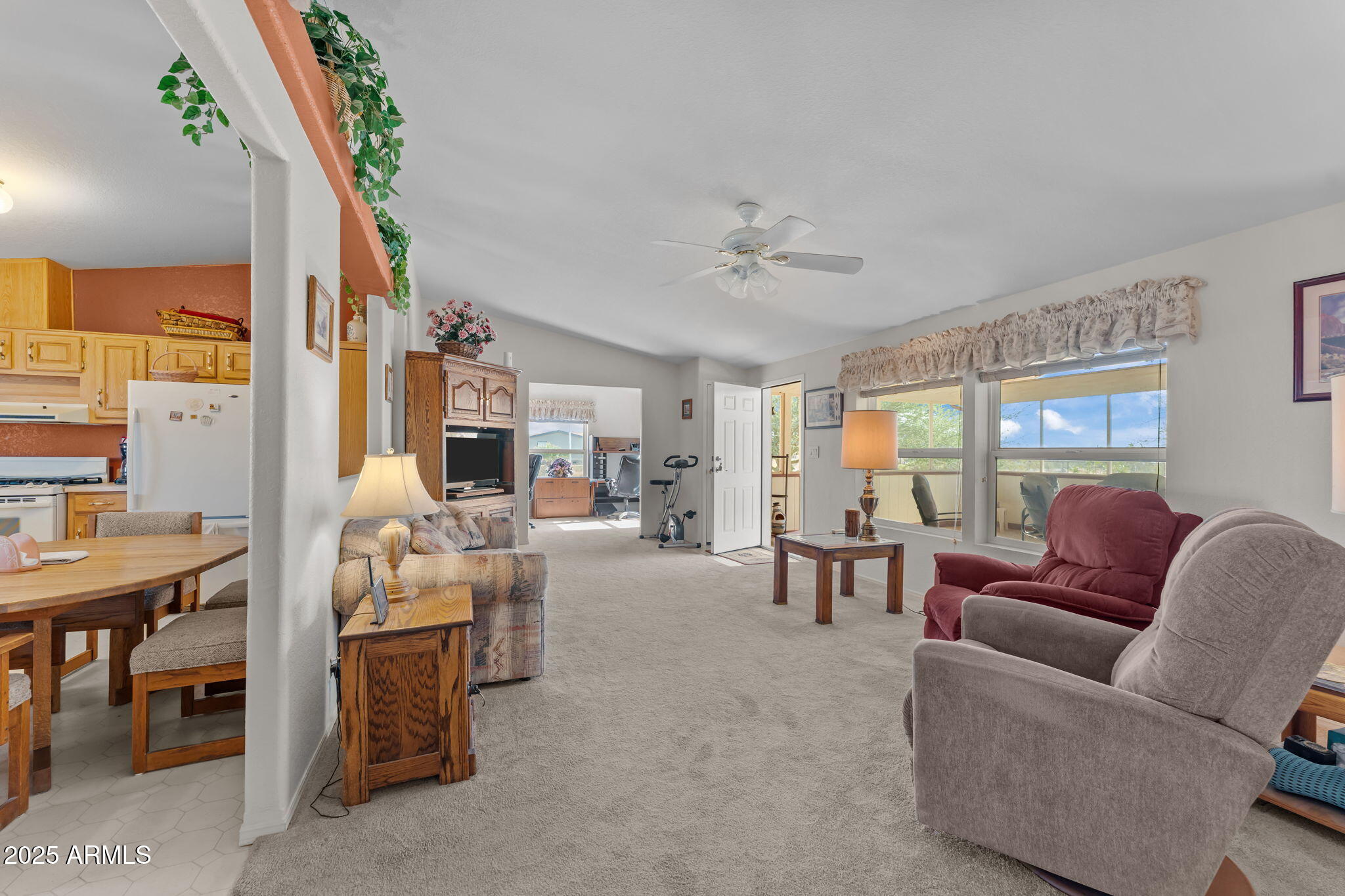 50910 West Long Rifle Road Aguila, AZ 85320 - Photo 11 of 59 a living room with furniture and a large window