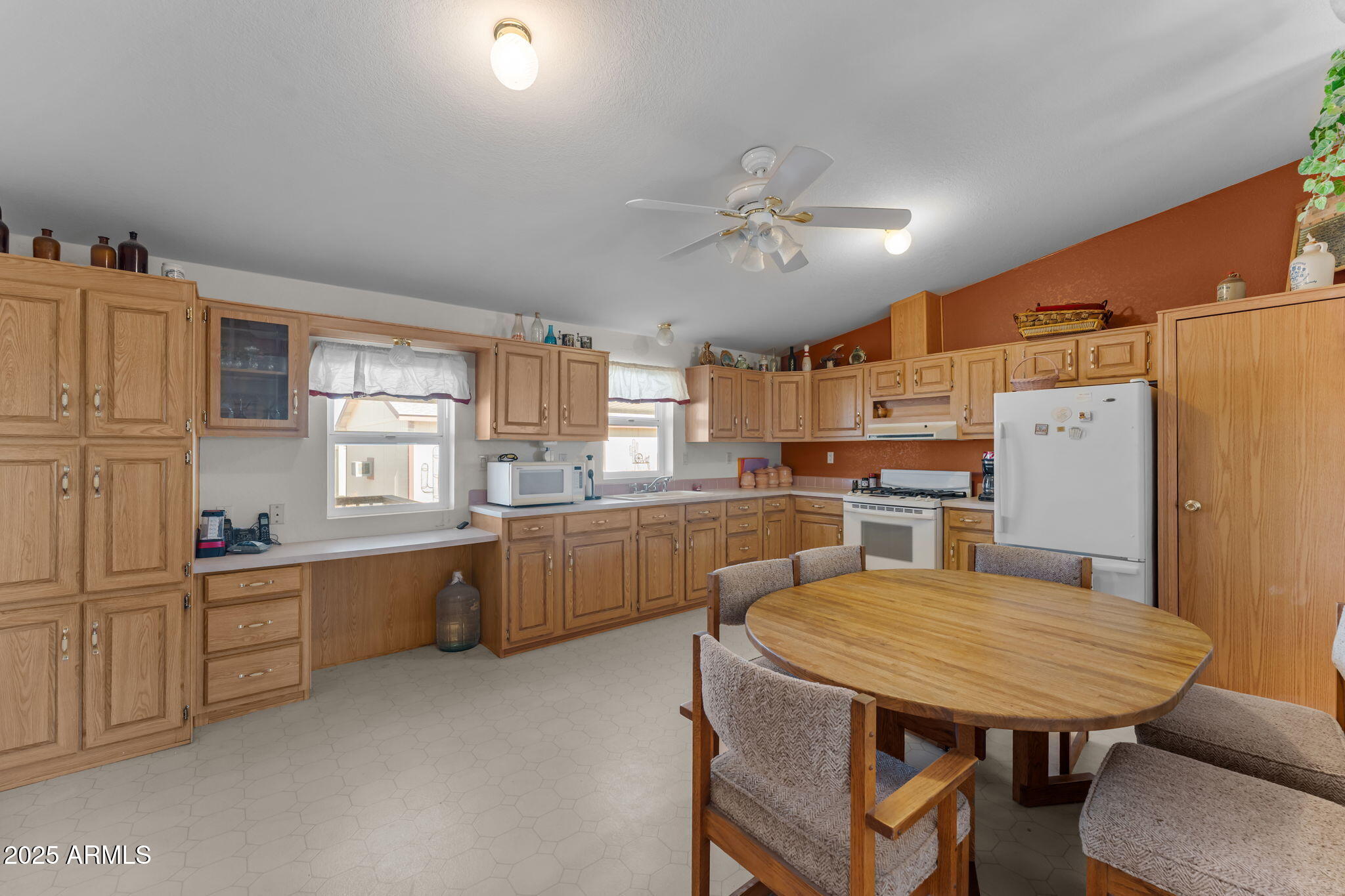 50910 West Long Rifle Road Aguila, AZ 85320 - Photo 12 of 59 a kitchen with refrigerator and window