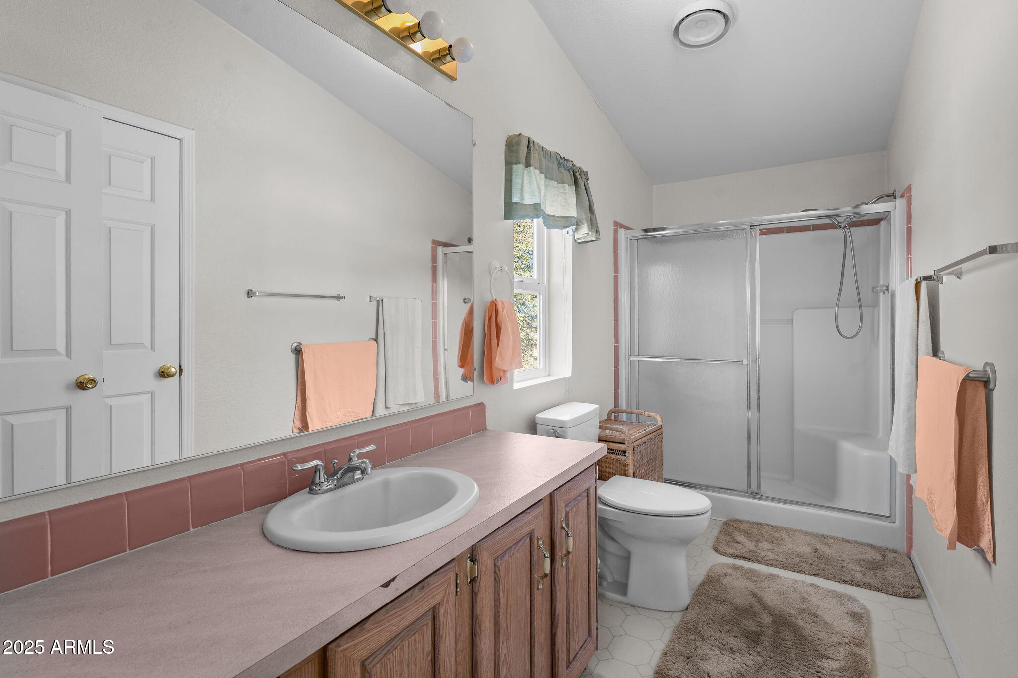 50910 West Long Rifle Road Aguila, AZ 85320 - Photo 18 of 59 a bathroom with a sink toilet double vanity and shower