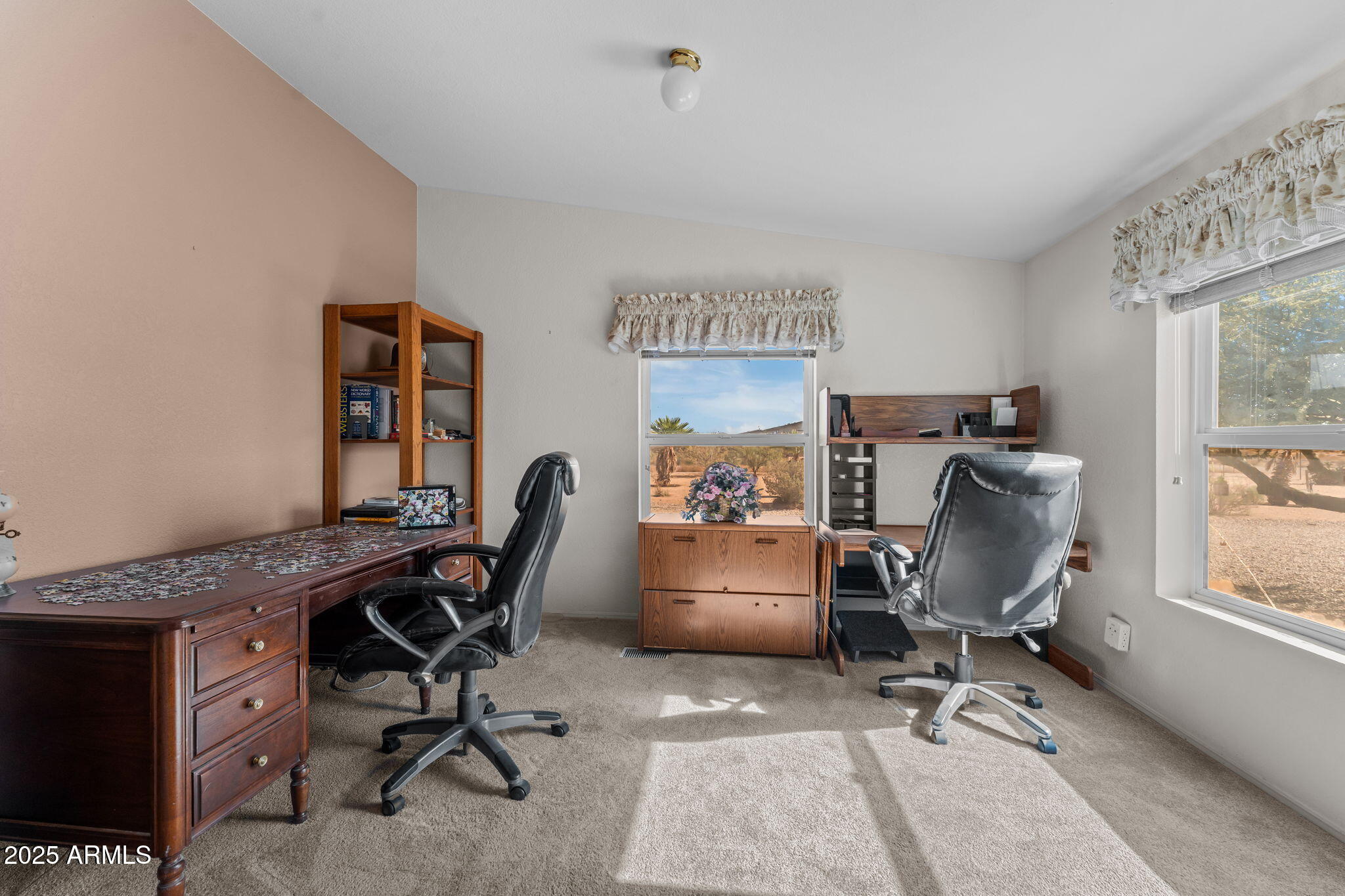 50910 West Long Rifle Road Aguila, AZ 85320 - Photo 20 of 59 a view of a workspace with furniture and a window