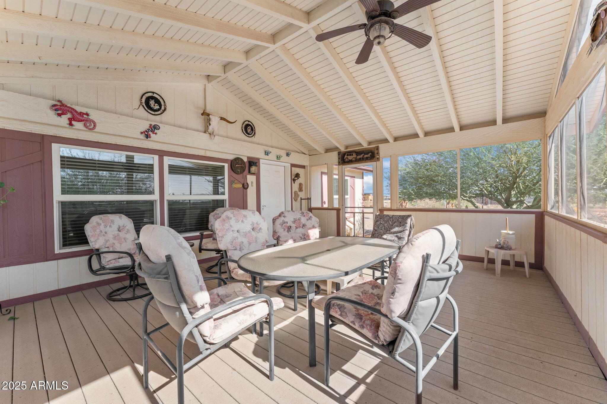 50910 West Long Rifle Road Aguila, AZ 85320 - Photo 23 of 59 a view of a dining room with furniture window and wooden floor