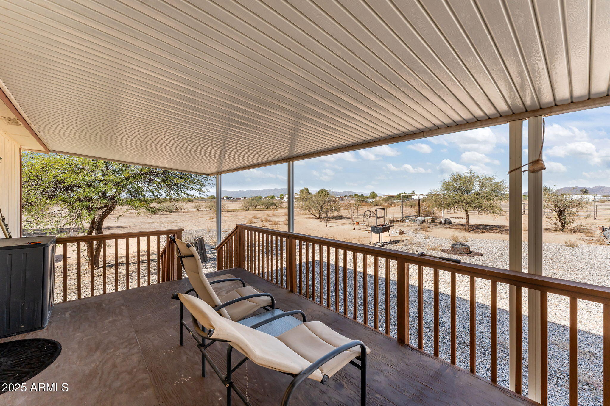 50910 West Long Rifle Road Aguila, AZ 85320 - Photo 24 of 59 a view of a two chairs in the balcony