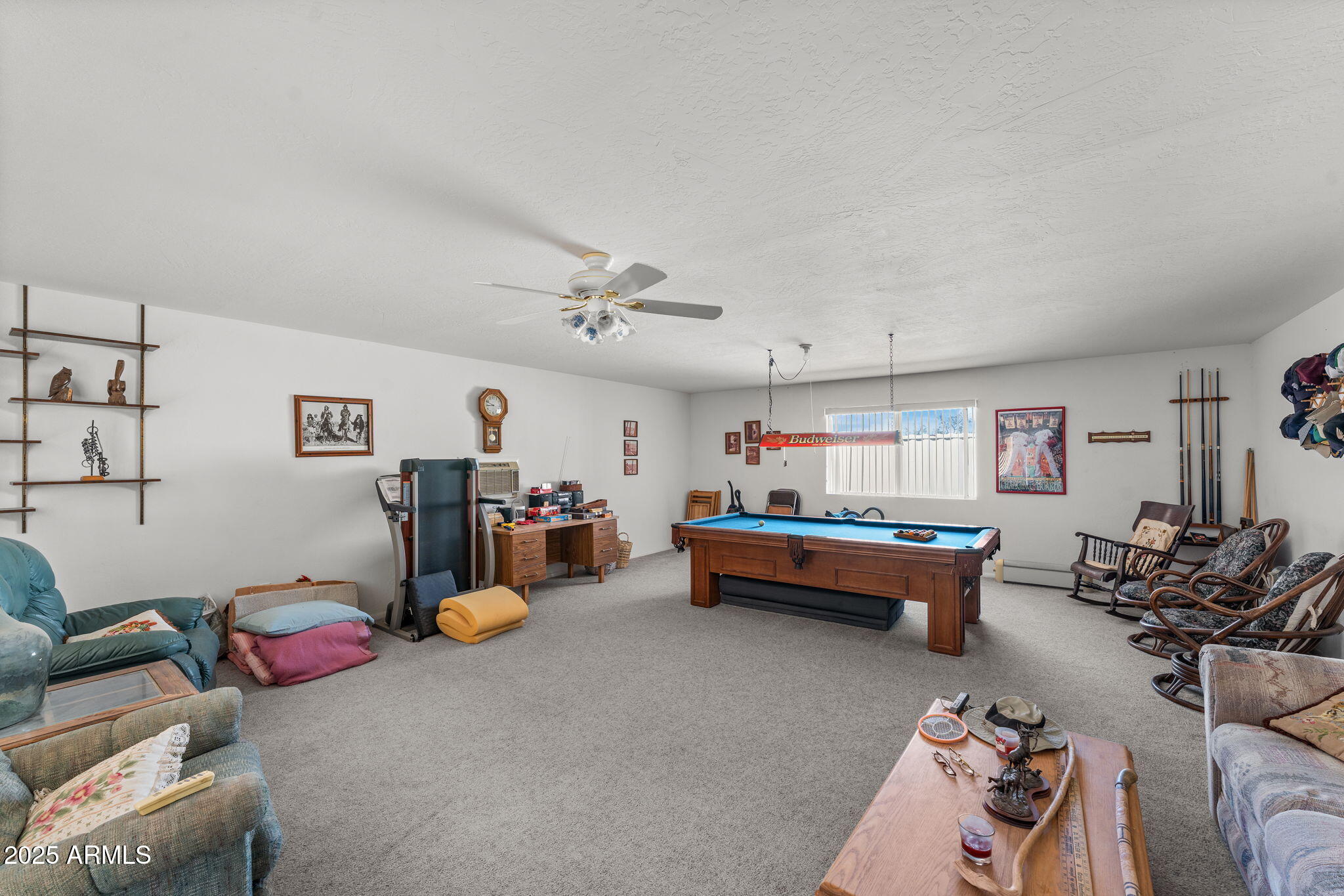 50910 West Long Rifle Road Aguila, AZ 85320 - Photo 26 of 59 a bed room with furniture and gym equipment