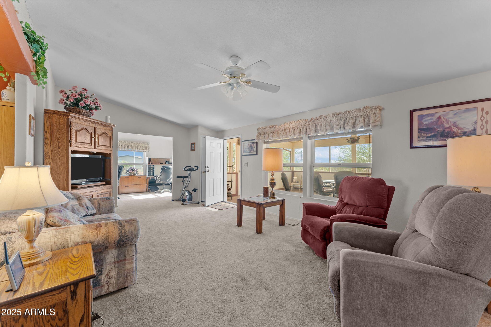 50910 West Long Rifle Road Aguila, AZ 85320 - Photo 8 of 59 a living room with furniture and a flat screen tv