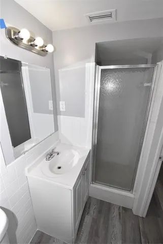 a bathroom with a bathtub a sink and a mirror