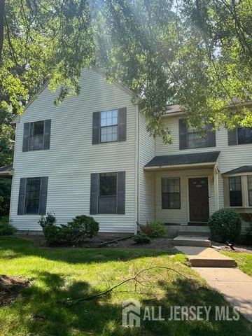 a view of a house with swimming pool and a yard