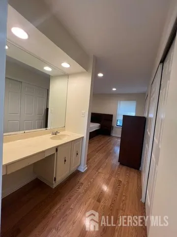 a large bathroom with a large tub and sink